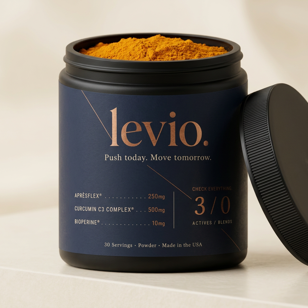 Open Levio tub showing fine deep turmeric-orange powder and steel scoop