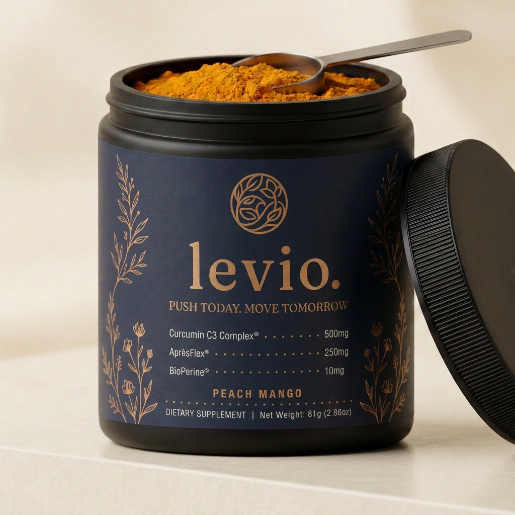 Open Levio tub showing fine deep turmeric-orange powder and steel scoop